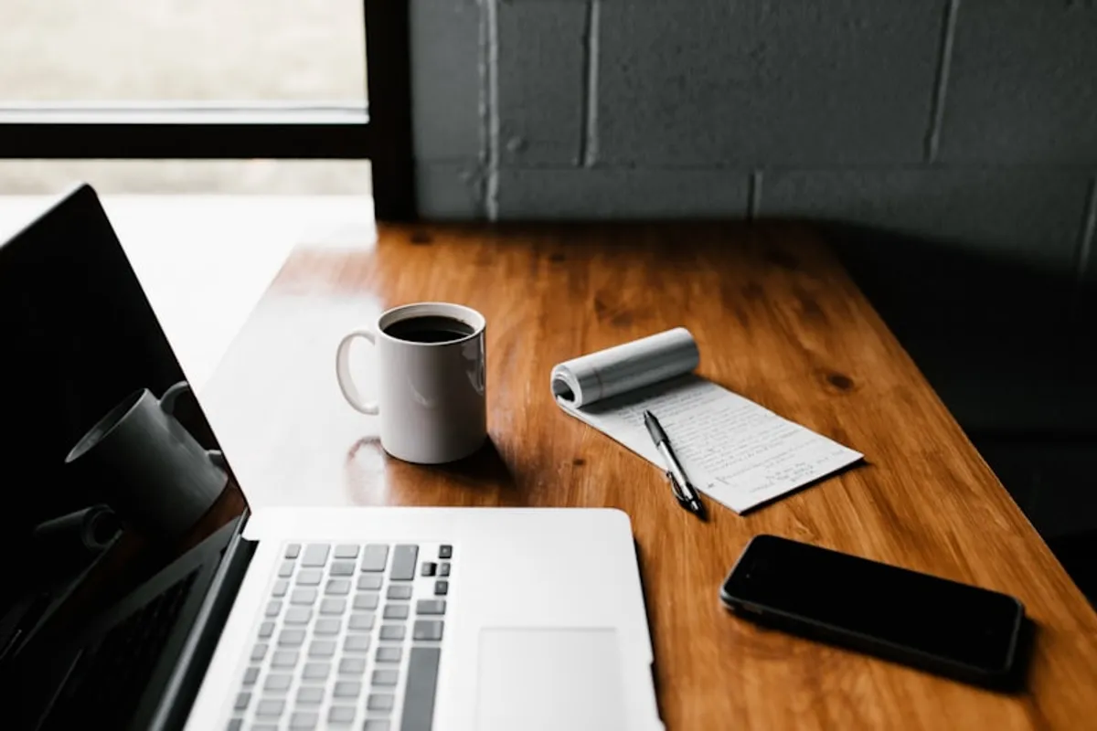 Content management workspace with notebook and laptop